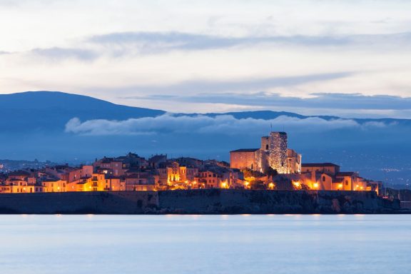 Antibes old town seen from the water at night